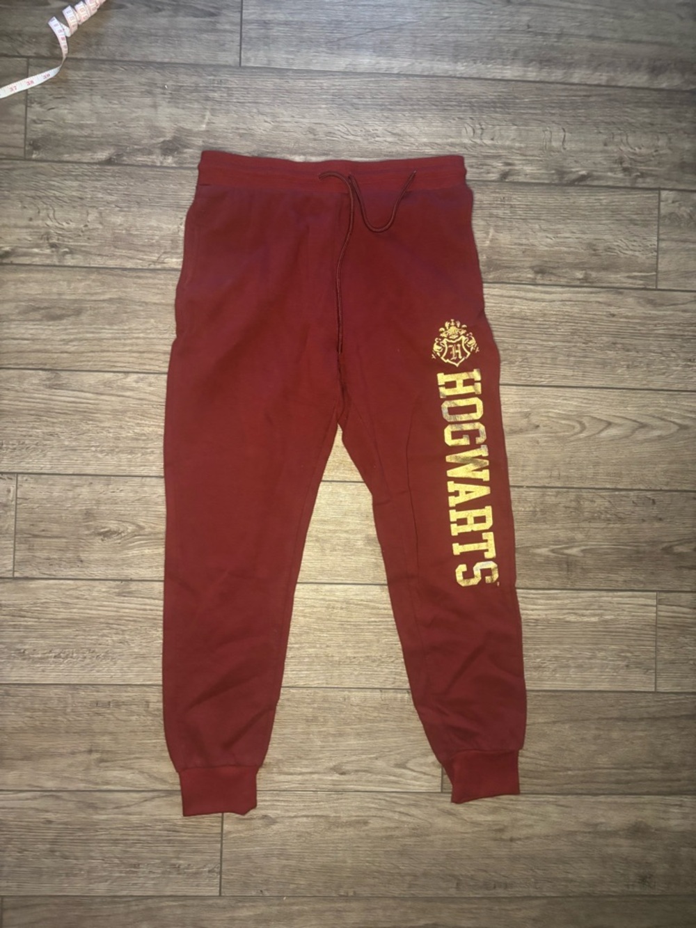 Warner Bros. Maroon Hogwarts Sweatpants with Gold Lettering